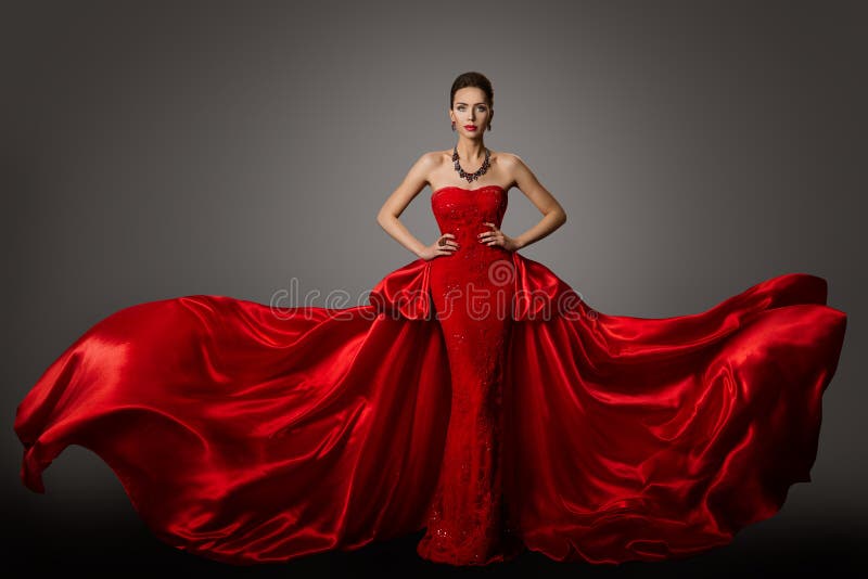 Mode-Modell Red Dress, Frau im langen flatternden wellenartig bewegenden Kleid, Schönheits-Porträt stockfotografie Mode-Modell Red Dress, Frau im langen flatternden wellenartig bewegenden Kleid, Schönheits-Porträt stockfotografie