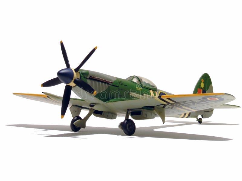 An assembled and painted model of a Supermarine Spitfire Mk 24 fighter plane - isolated with its shadow over pure white. An assembled and painted model of a Supermarine Spitfire Mk 24 fighter plane - isolated with its shadow over pure white.