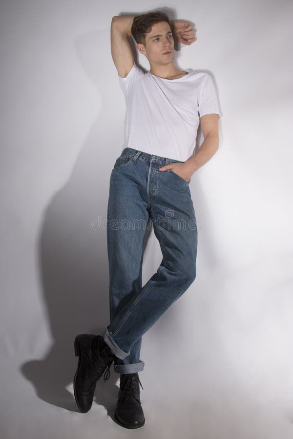 Muscular Man in White Tshirt and Jeans on White Posing Stock Photo ...