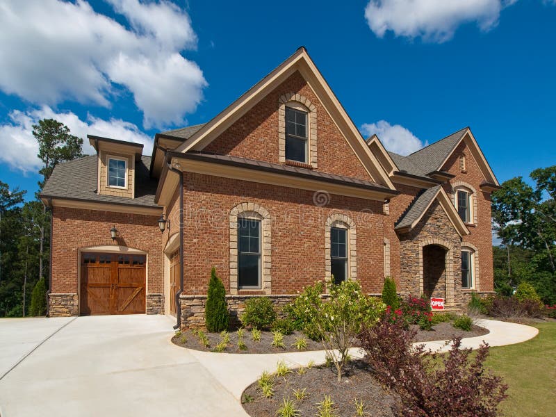 Model Luxury Home Exterior side view clouds royalty free stock images Model Luxury Home Exterior side view clouds royalty free stock images