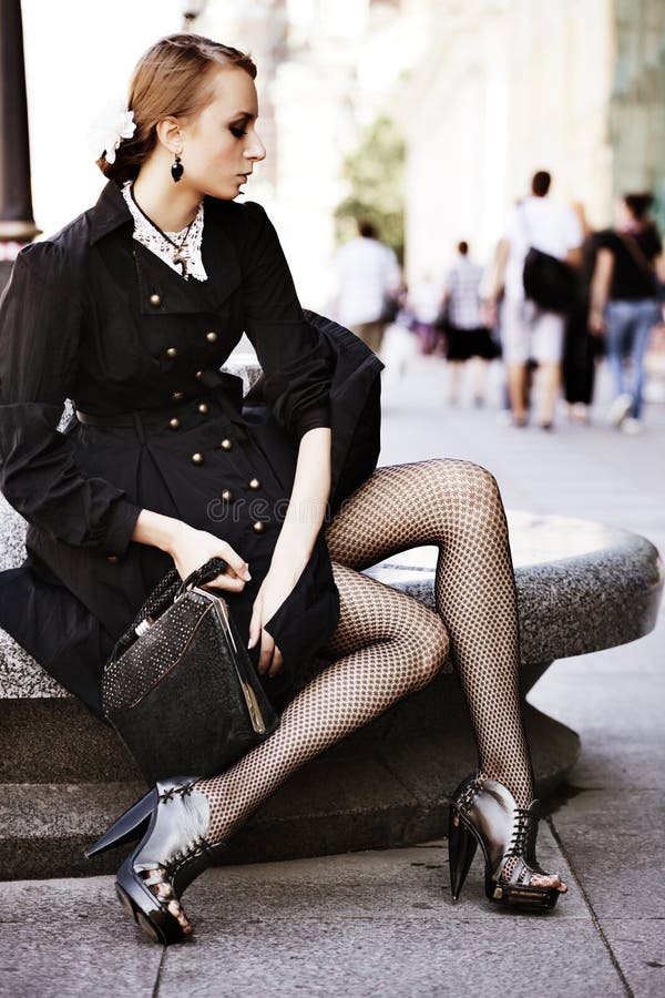 Model posing on a city street