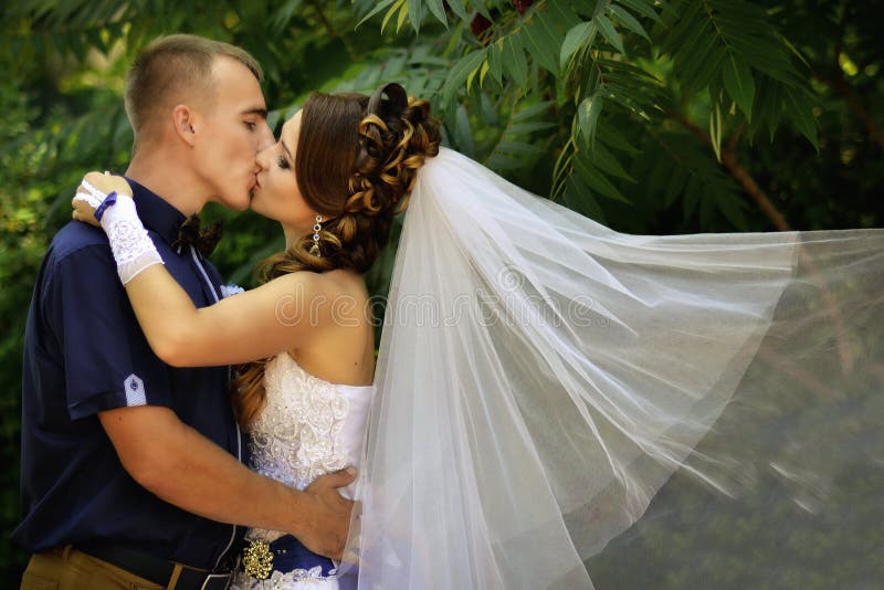 Handsome man, full of passion kiss very beautiful woman outdoors royalty free stock photo Handsome man, full of passion kiss very beautiful woman outdoors royalty free stock photo