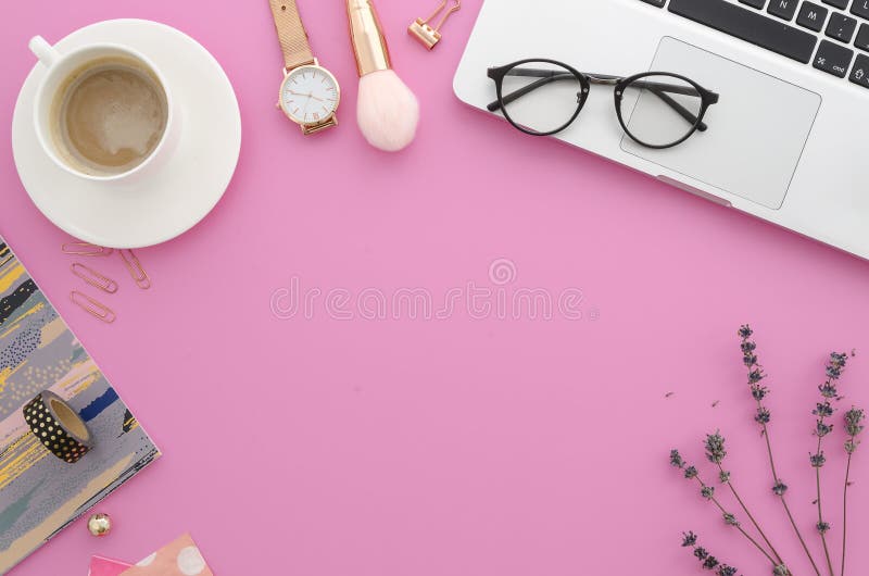 Female workspace with laptop, lavender, makeup accessories, notebook, glasses, coffee. Flat lay women`s office desk. Top view feminine background. Mockup. Female workspace with laptop, lavender, makeup accessories, notebook, glasses, coffee. Flat lay women`s office desk. Top view feminine background. Mockup