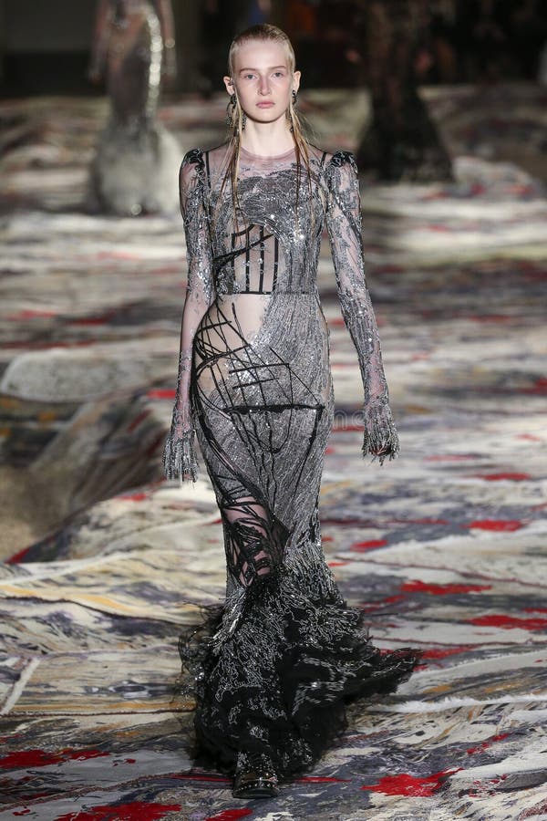 A Model Walks the Runway during the Alexander McQueen Designed by Sarah ...