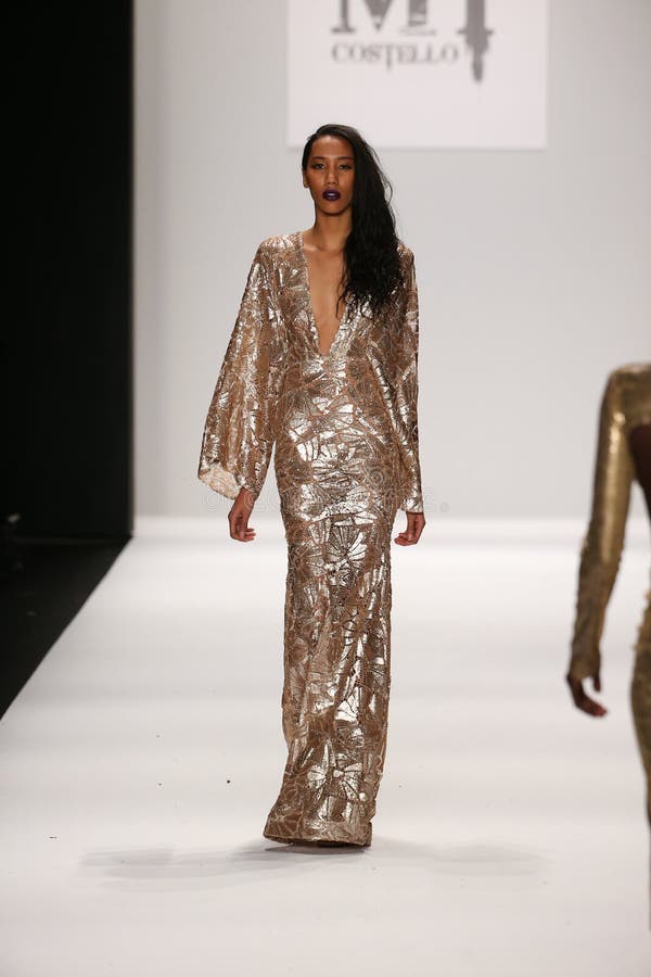 A Model Walks the Runway in a MT Costello Design at the Art Hearts ...