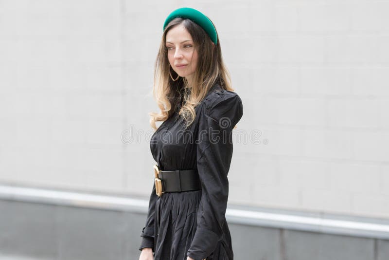 Model Wears a Black Dress, a Striking Black Gucci Belt, a White Gucci  Handbag and a Green Hair Clip Editorial Image - Image of milan, black:  161573770