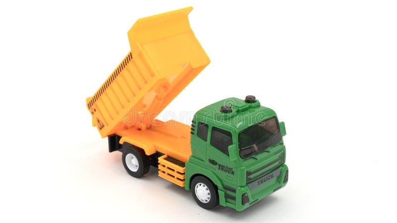 Model of toy dumper truck isolated on white. High quality photo. Model of toy dumper truck isolated on white. High quality photo