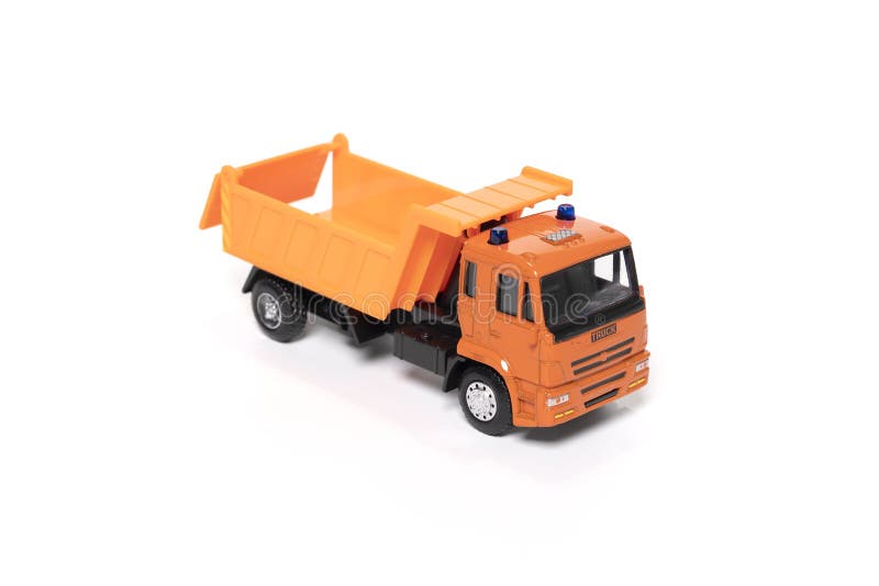 Model of toy dumper truck isolated on white. High quality photo. Model of toy dumper truck isolated on white. High quality photo