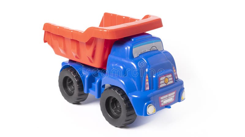 Model of toy dumper truck isolated on white. High quality photo. Model of toy dumper truck isolated on white. High quality photo