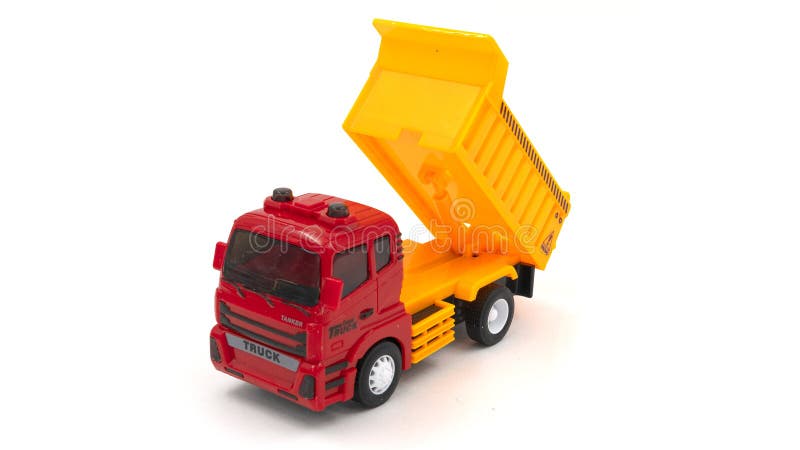 Model of toy dumper truck isolated on white. High quality photo. Model of toy dumper truck isolated on white. High quality photo