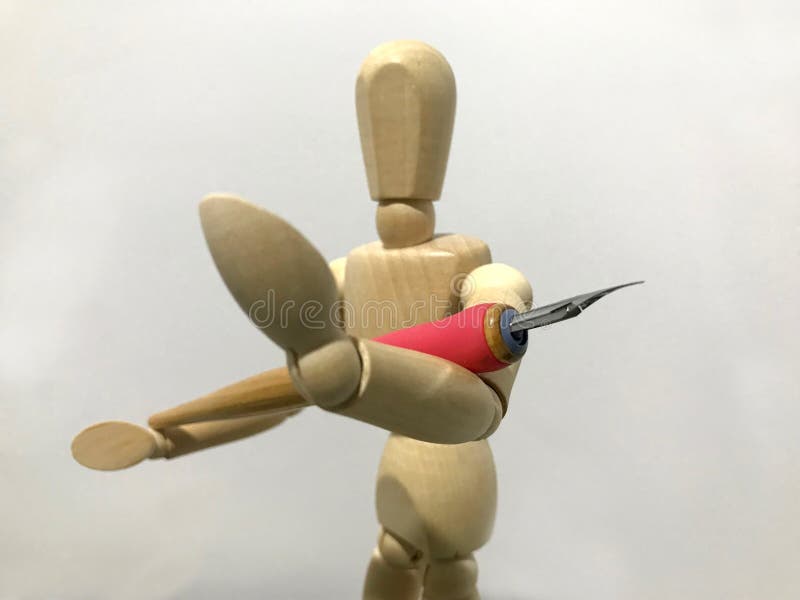 Model art reference holding a calligraphy pen tool. Modeling art body posture reference with a calligraphic tool focus on the camera