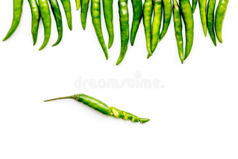 Hot chilli pepper pattern on white table background top view