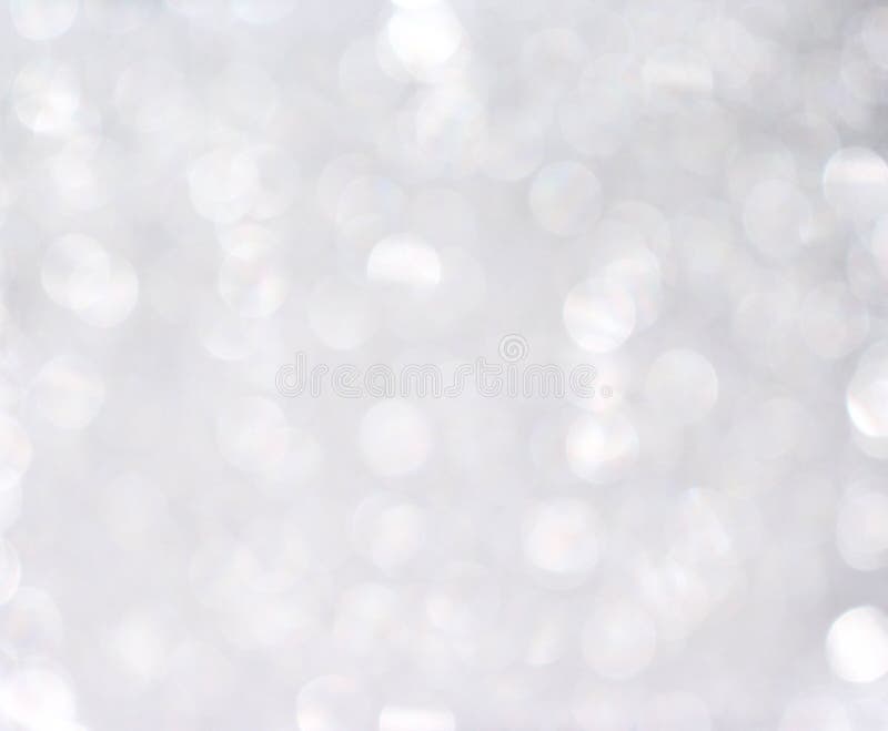 Modello astratto del bokeh di scintillio d'argento o bianco per il fondo di Natale fotografie stock libere da diritti Modello astratto del bokeh di scintillio d'argento o bianco per il fondo di Natale fotografie stock libere da diritti