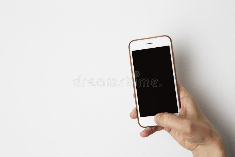 Modello dello smartphone con la mano nera vuota del maschio della tenuta dello schermo Gli oggetti business svuotano il fondo del immagine stock Modello dello smartphone con la mano nera vuota del maschio della tenuta dello schermo Gli oggetti business svuotano il fondo del immagine stock