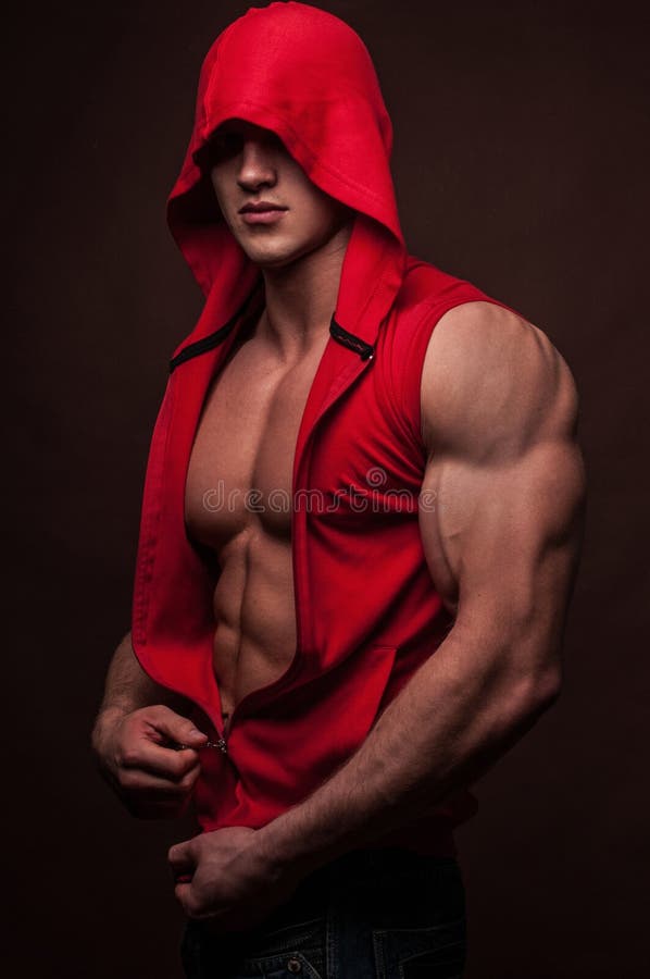 Muscled male model in shirt with a hood. Muscled male model in shirt with a hood