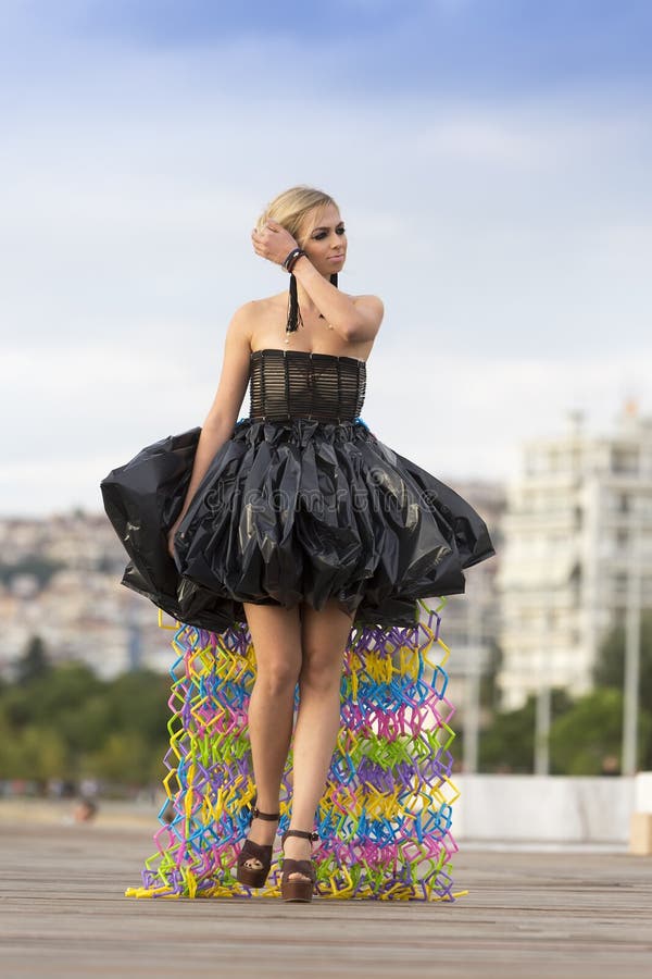 Models Walk an during Outdoor Fashion Show with Clothing Made O ...