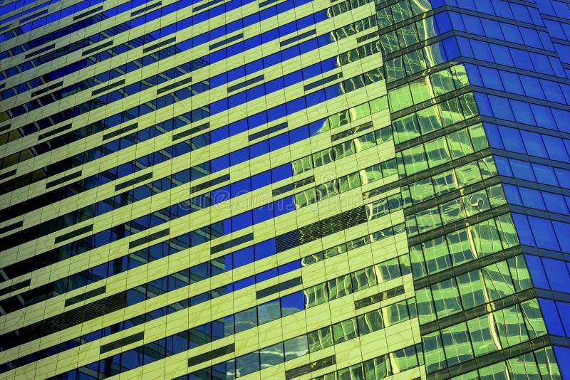 Modern abstract building, geometric pattern of glass and concrete, design with reflection. Urban building background stock photography Modern abstract building, geometric pattern of glass and concrete, design with reflection. Urban building background stock photography