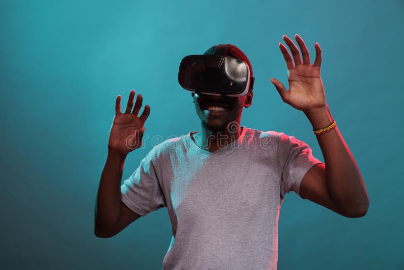 Modern Adult Playing with Virtual Reality Goggle on Camera Stock Image