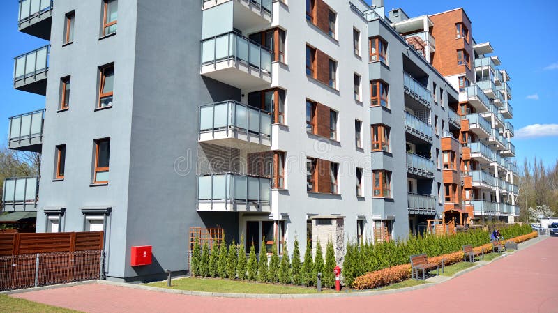 Modern apartment building in Bielany district on a sunny day with a blue sky. Facade of a modern apartment.