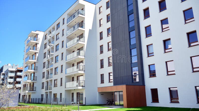 Modern apartment building in Bielany district on a sunny day with a blue sky. Facade of a modern apartment.