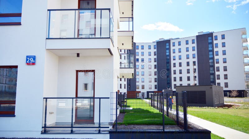 Modern apartment building in Bielany district on a sunny day with a blue sky. Facade of a modern apartment.