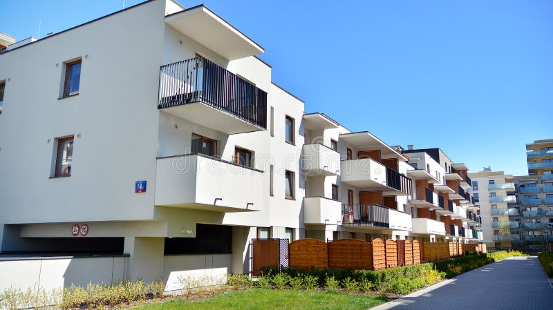 Modern apartment building in Bielany district on a sunny day with a blue sky. Facade of a modern apartment.