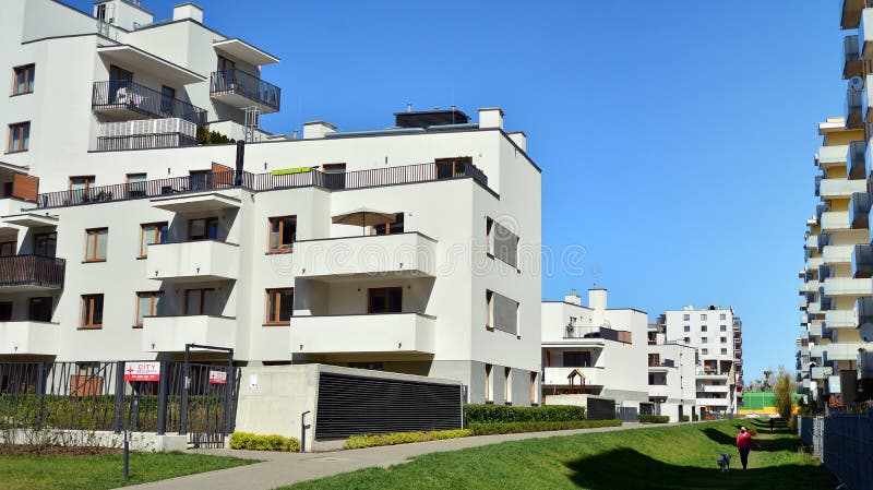 Modern apartment building in Bielany district on a sunny day with a blue sky. Facade of a modern apartment.