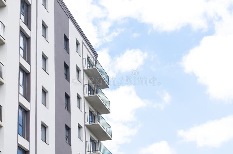 Modern apartment building facade on sky background royalty free stock photography