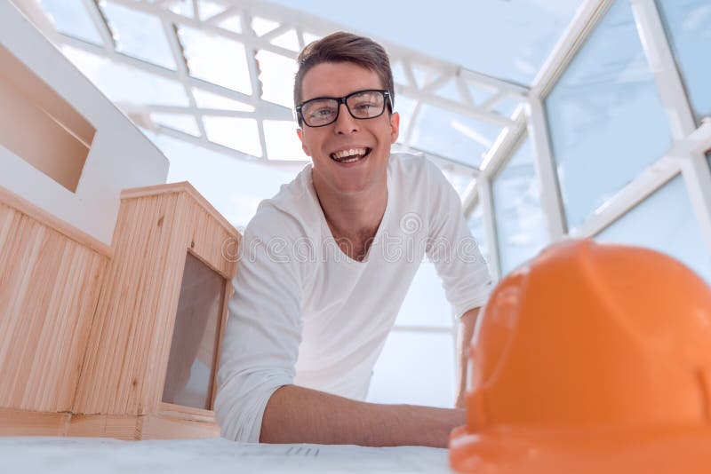 Modern architect sitting at a Desk in a design Studio stock image