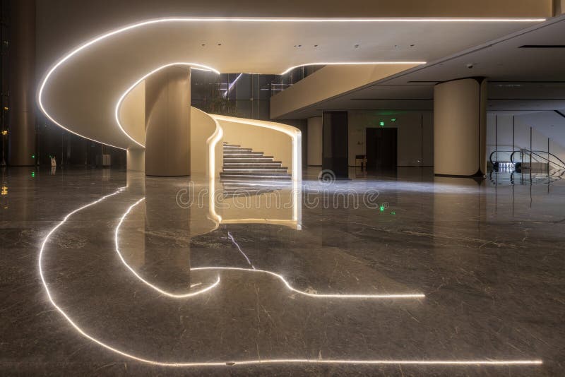 Modern architectural interior spiral staircase lighting decoration stock photo