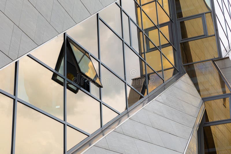 Modern architecture geometry construction with glass building facade, diagonal view royalty free stock photos Modern architecture geometry construction with glass building facade, diagonal view royalty free stock photos