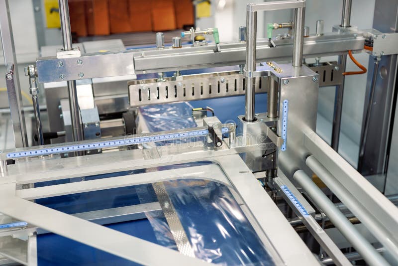 Machine for Packing Long Items. Industrial Packaging Technology Stock