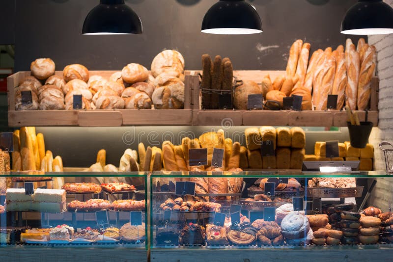 Modern bakery with different kinds of bread royalty free stock photography
