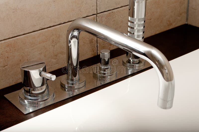 Modern bathroom faucet royalty free stock photography