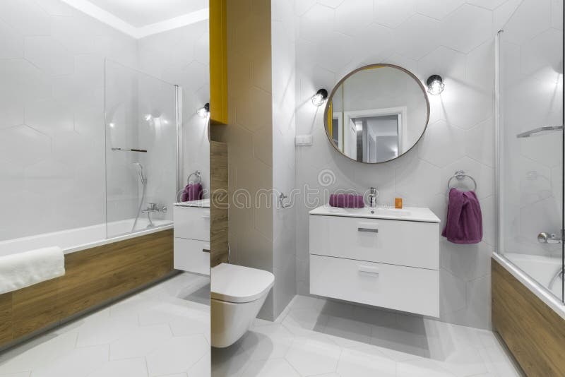 Modern bathroom with oval mirror