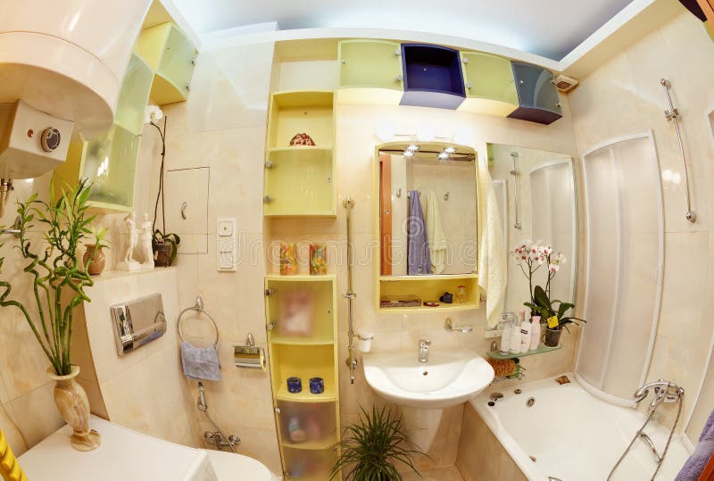 Modern Bathroom in yellow and blue vivid colors fisheye view. Bathtub stand stock images, royalty-free photos and pictures