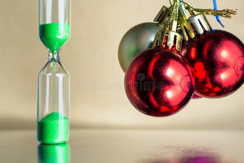 Modern beautiful green hourglass with bright background for copy space. Hourglass time passing concept for christmas or royalty free stock photography Modern beautiful green hourglass with bright background for copy space. Hourglass time passing concept for christmas or royalty free stock photography