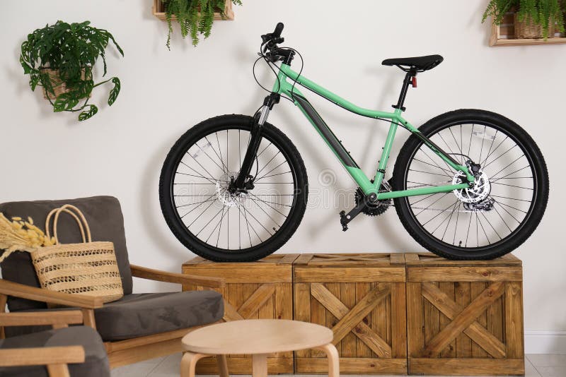 Modern Bicycle and Comfortable Armchairs in Living Room Interior Stock