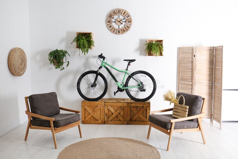 Modern Bicycle and Comfortable Armchairs in Living Room Interior Stock