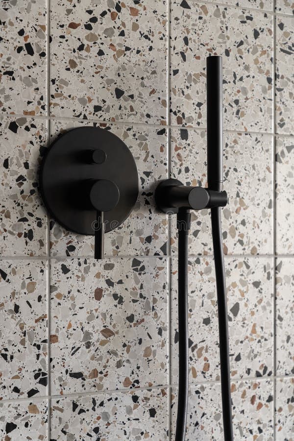 New black shower head on holder in white tiled bathroom in modern apartment  Stock Photo - Alamy