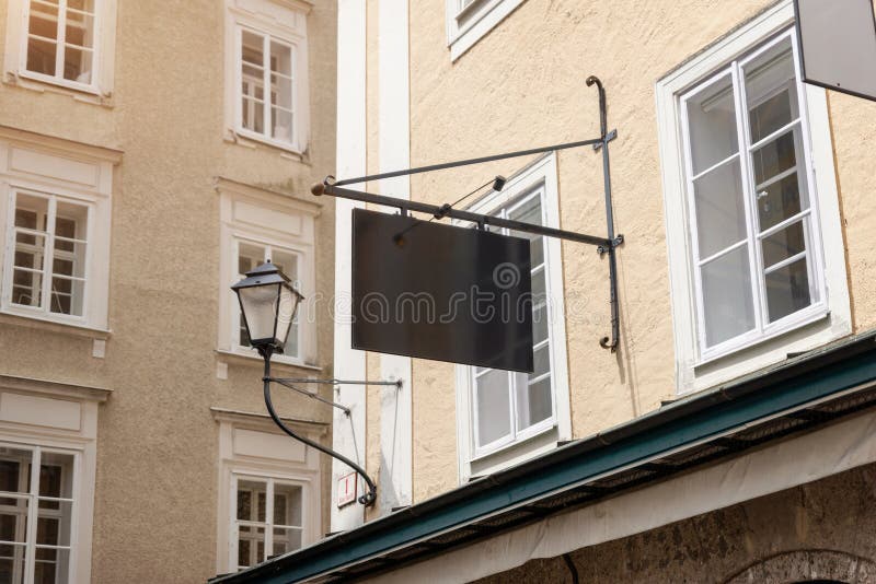 Modern blank rectangular signage mounted on rods, ideal for contemporary store branding royalty free stock images