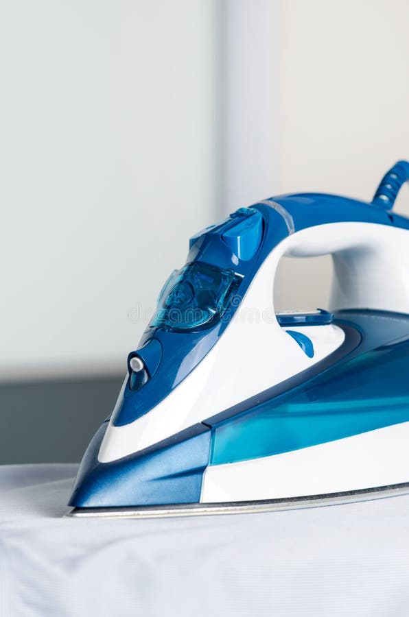 Modern Blue Steam Iron on Ironing Board Stock Image Image of