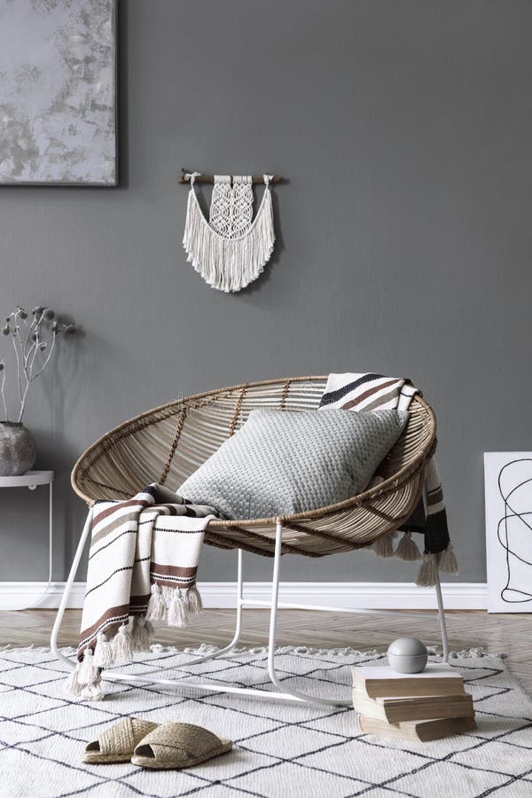 Boho interior design of living room with rattan armchair.