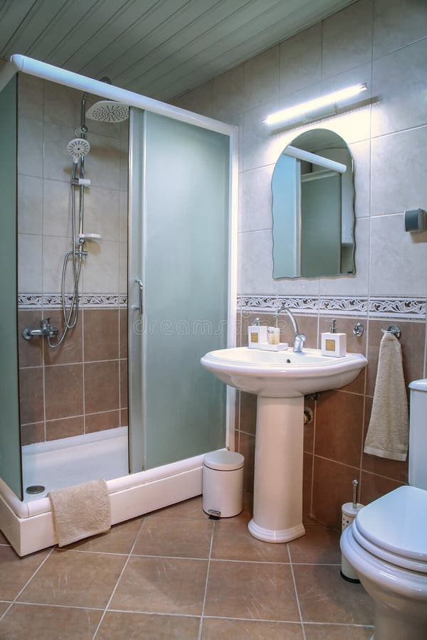 Modern Brown Bathroom with Shower, Sink and Brown Tiles Stock Image