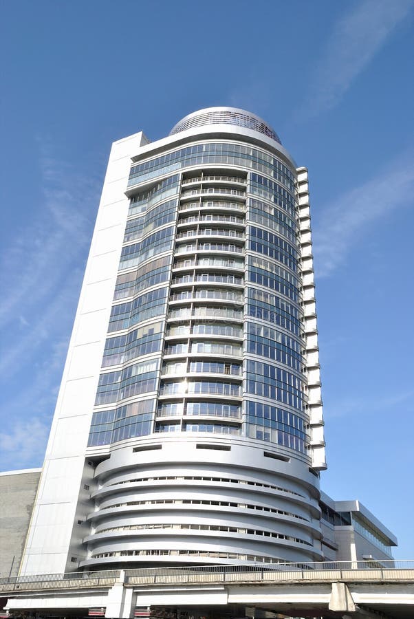 The modern building is against blue sky