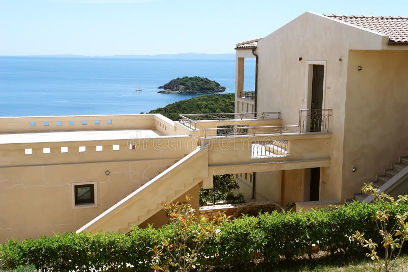 Modern building in antique style and the Ionian Sea in Greece.