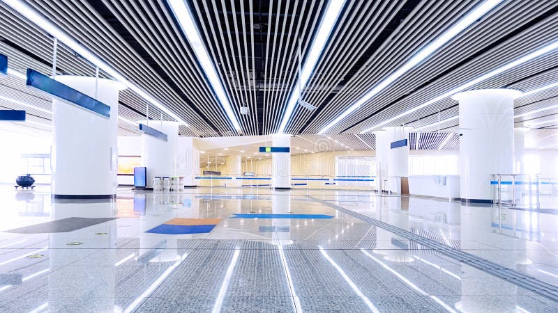 The glowing  ceiling of  modern  building corridor ,Illuminated by shot lamps and panel light . The glowing  ceiling of  modern  building corridor ,Illuminated by shot lamps and panel light .