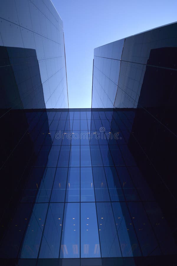 Modern building in glass on blue sky