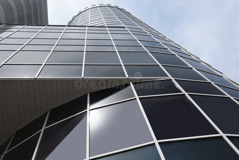 Modern  with tinted windows against sky, low angle view. Urban architecture