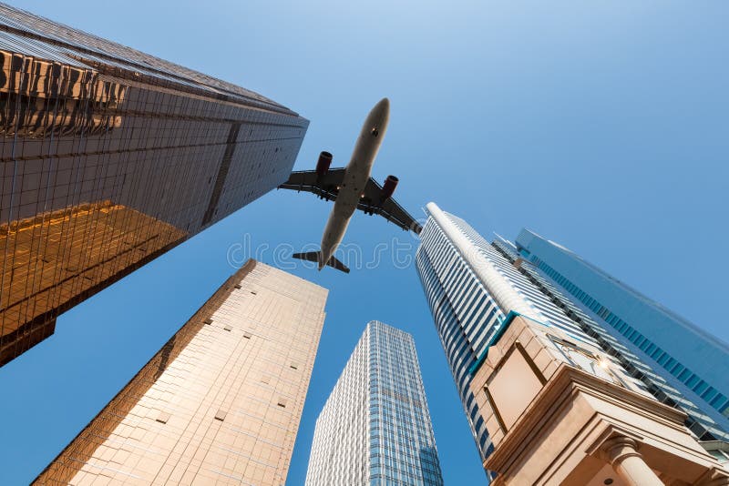 Modern building underneath airplane royalty free stock photography Modern building underneath airplane royalty free stock photography
